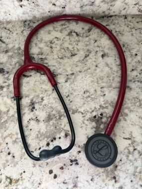 Maroon Stethoscope with Black accent metal.
